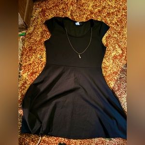 Black skater dress with attached necklace.